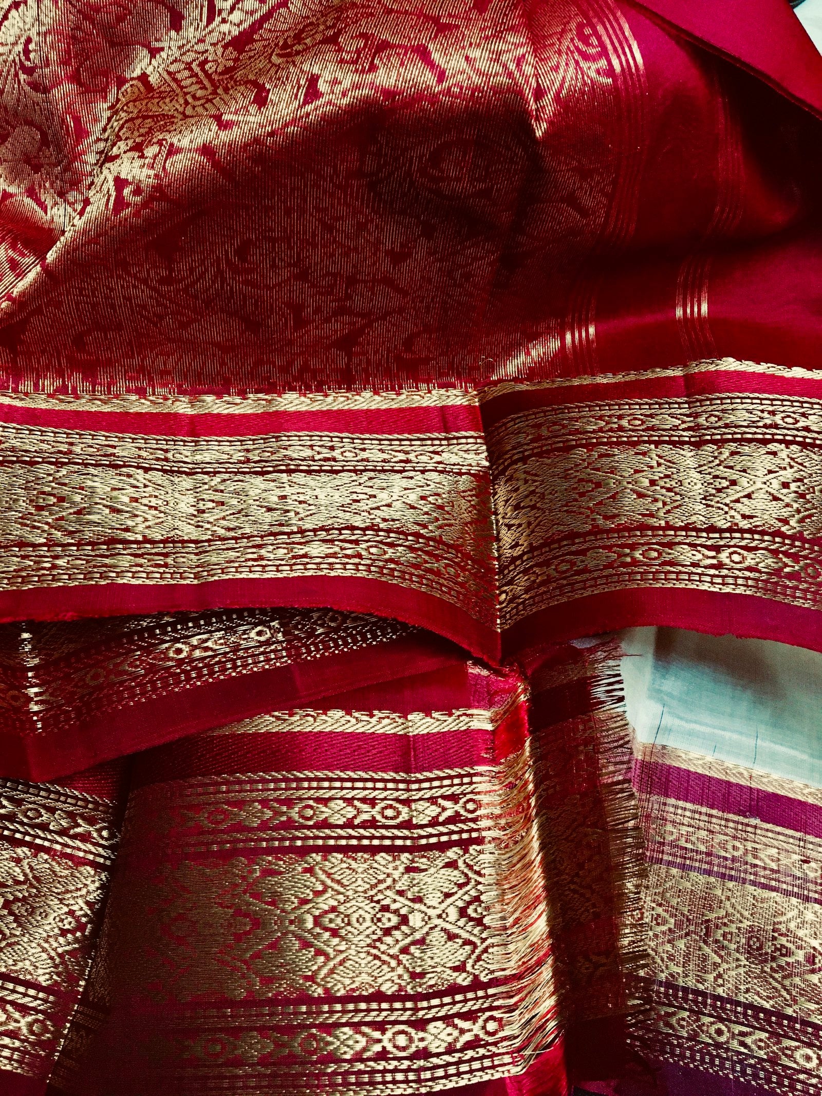 Close-up of red, white and blue saree textile fabric